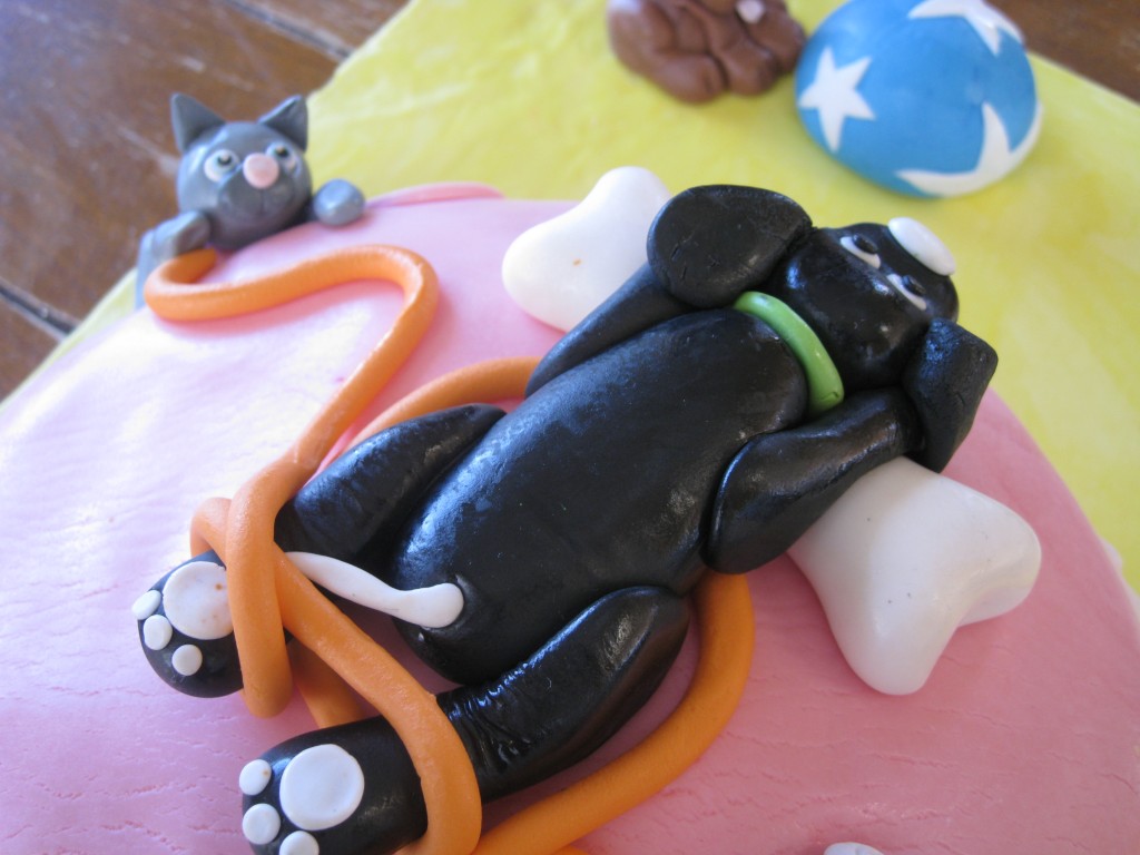 Fondant puppy and kitten cake